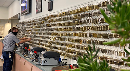 Wall of key blanks above key cutting machines in the showroom.