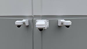 Security cameras on corner of a wall