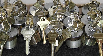Stamped keys inserted into mortise cylinders ready for installation.